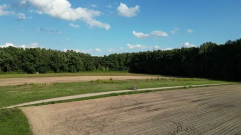Aerial View of Bikers in Fields and Kabacki Forest in Warsaw Видео 249398610
