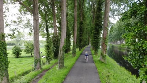 Aerial View Of Biking Through Belgium Countryside Stock Footage