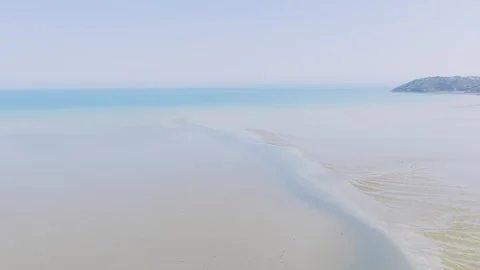Aerial view of Binic beach on the Brittany coast of France, captured at low tide Stock Footage 346689531