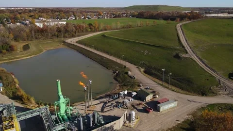 Aerial view of Biogas facility with burning off methane from a landfill in Stock Footage 306068919