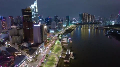 Aerial view of Bitexco Tower, buildings, roads, Thu Thiem 2 bridge and Saigon Stock Footage 201921998