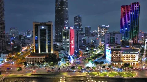 Aerial view of Bitexco Tower, buildings, roads, Thu Thiem 2 bridge and Saigon Stock Footage 201922117