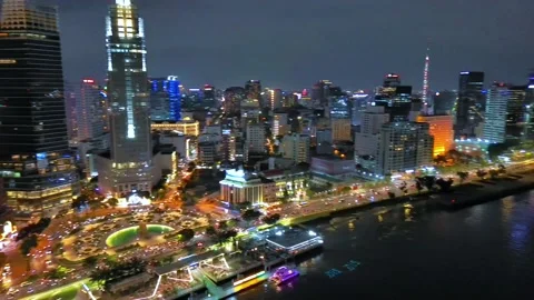 Aerial view of Bitexco Tower, buildings, roads, Thu Thiem 2 bridge and Saigon Stock Footage 201922341