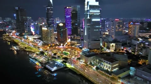 Aerial view of Bitexco Tower, buildings, roads, Thu Thiem 2 bridge and Saigon Stock Footage 201922444