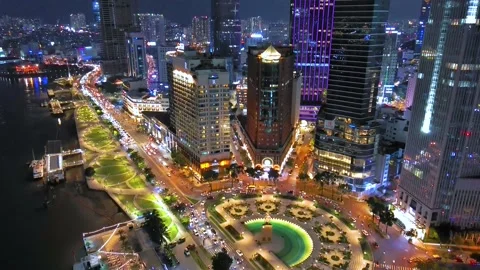 Aerial view of Bitexco Tower, buildings, roads, Thu Thiem 2 bridge and Saigon Stock Footage 201922500