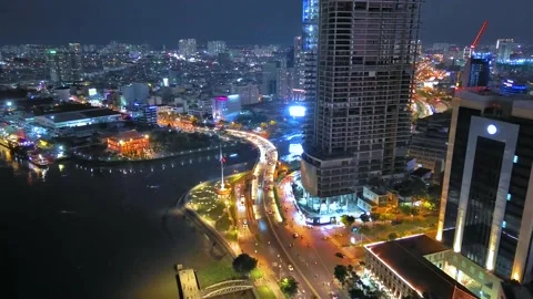 Aerial view of Bitexco Tower, buildings, roads, Thu Thiem 2 bridge and Saigon Stock Footage 201923164