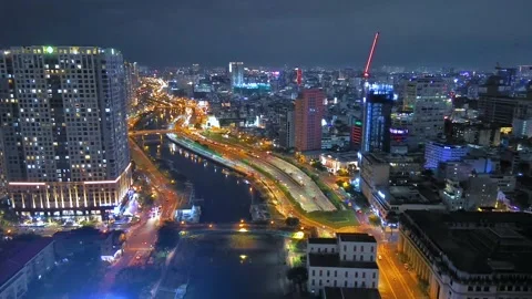 Aerial view of Bitexco Tower, buildings, roads, Thu Thiem 2 bridge and Saigon Stock Footage 201923376