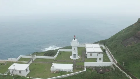 Aerial View of Bitoujiao Lighthouse with sight of Taipei Gulf, HD Drone Footage Stock Footage 104819205