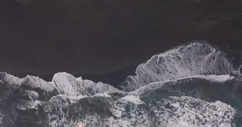 Aerial view. Black sand beach. Beautiful ocean waves crashing on coastline Video stock 145611575