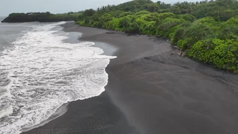 Aerial view of black sand beach in Bali, Indonesia Stock Footage 320516050