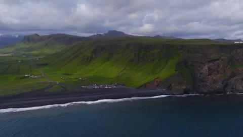 Aerial view of black sand beach near Vik, Iceland with cliffs Video stock 340836991