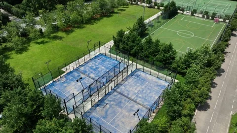 Aerial View Of Blue Fenced Padel Court Complex For Outdoor Sports And Recreation Stock-Footage 319468614