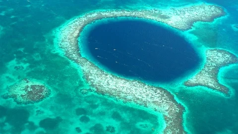Aerial view of the Blue Hole coral reef in Belize Stock Footage