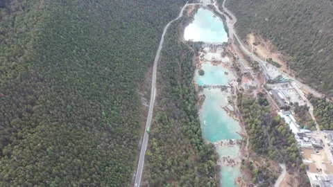 Aerial view of Blue Moon Valley and winding road in Lijiang Yunnan China. 스톡 동영상 345044948