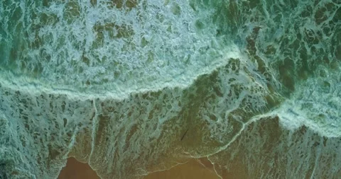 Aerial View of Blue Ocean Waves Rolling Toward Tropical Beach Stock Footage 331188806