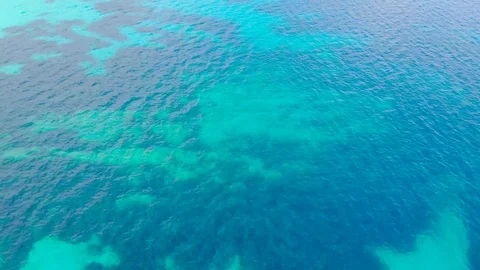 Aerial view of blue sea surface with light reflections Stock Footage 108007883