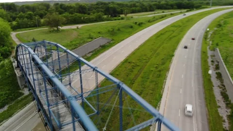 Aerial View of Blue Walking Bridge over Highway in Delphi, Indiana Stock Footage 146103592