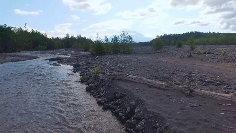 Aerial view. Blurred river in the mountains. The road was washed with water Stock Footage 73527741