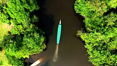 Aerial View of Boat on Amazon River Surrounded by Jungle Stock-Footage 289804396