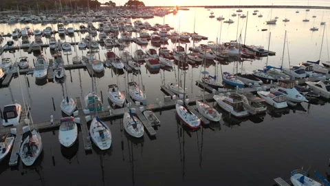 Aerial view of boat dock, Drone flying over water and sailing yachts. Video stock 112339324