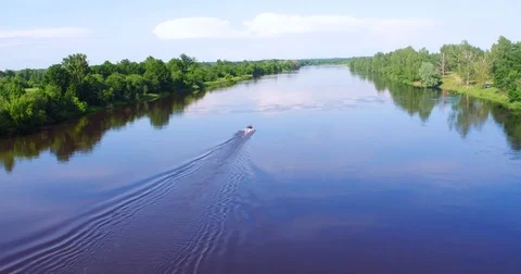 Aerial View. boat floats on the river in summer day Stock Footage