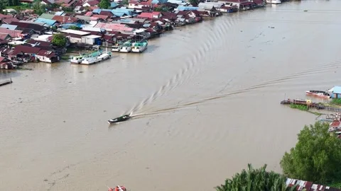 Aerial view of a boat moving on a large river area Stock Footage 336473709