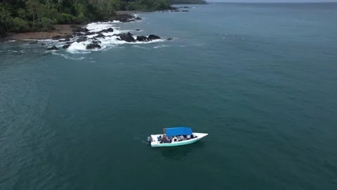 Aerial view of boat with rays jumping to the back Stock Footage 234366554