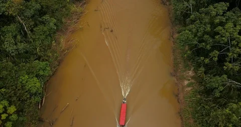 Aerial View of a Boat on a River in the Amazon Rain Forest in Brazil Stock Footage 92973533