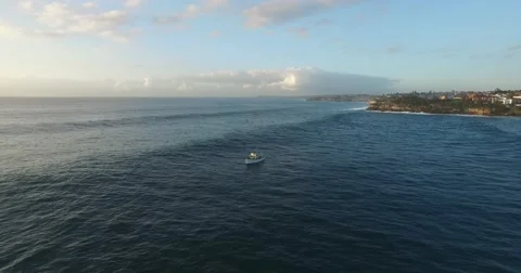 Aerial View Of Boat Rolling Over Big Swell Stock Footage 60903294