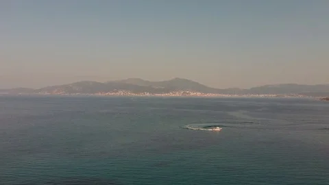 Aerial view of a boat sailing in the coasts of Corsica Stock Footage 116435517