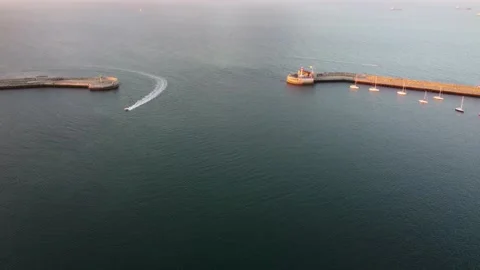 Aerial View Of A Boat Sailing Entering Harbor Stock Footage 209623853