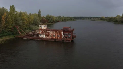 Aerial view of boat, ship and barge graveyard on the Pripyat Stock Footage 128387501