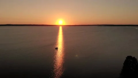 Aerial view of a boat in sunset on the lake Video stock 170236853