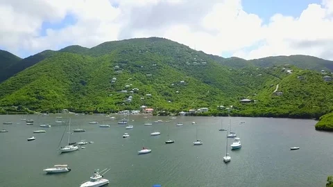 Aerial view of boats above St Johns Virgin Islands water Stock Footage