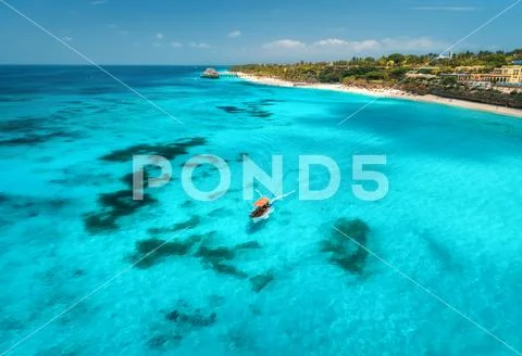 Aerial view of boats on tropical sea coast with sandy beach Stock Photos