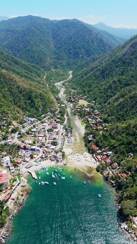 Aerial View of Boca de Tomatlan Town, Puerto Vallarta, Mexico. Vertical Vide Stock Footage 274318183