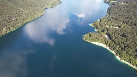 Aerial view on Bohinj lake between mountains with forest in Slovenia, Europe Video stock 332421835