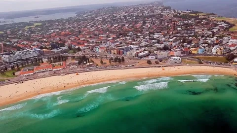 Aerial view of Bondi Beach and coastal residential area in Sydney Stock Footage 337165060