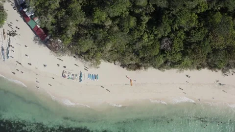 Aerial View of Boracay Puka Shell Beach with Boats, Forest, and Visitors on Shor Stock Footage 340321222