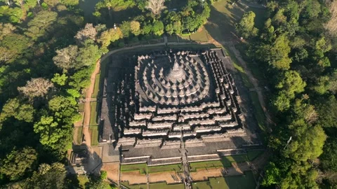 Aerial view of Borobudur Temple surrounded by lush jungle Central Java Indonesia Vídeos de archivo 337495836
