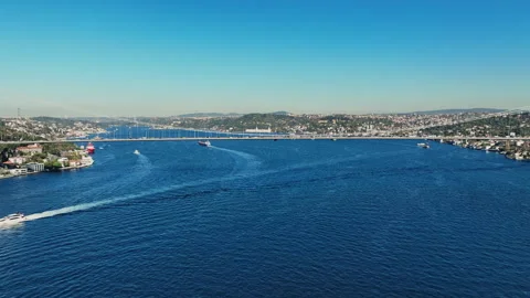 Aerial view of the Bosphorus Bridge with drone on a cloudy day. Tanker ship pass Stock Footage 322912085