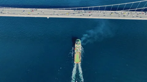 Aerial view of the Bosphorus Bridge with drone on a cloudy day. Tanker ship pass Stock Footage 322912301