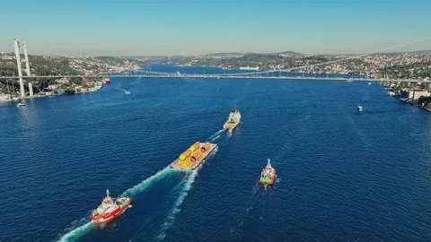 Aerial view of the Bosphorus Bridge with drone on a cloudy day. Tanker ship pass Stock Footage 322912314