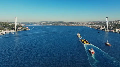 Aerial view of the Bosphorus Bridge with drone on a cloudy day. Tanker ship pass Stock Footage 322912345