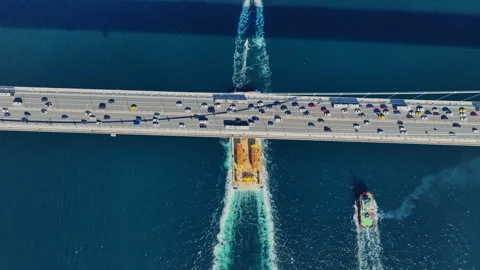 Aerial view of the Bosphorus Bridge with drone on a cloudy day. Tanker ship pass Stock Footage 322912495