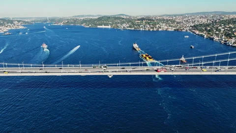 Aerial view of the Bosphorus Bridge with drone on a cloudy day. Tanker ship pass Stock Footage 322912593