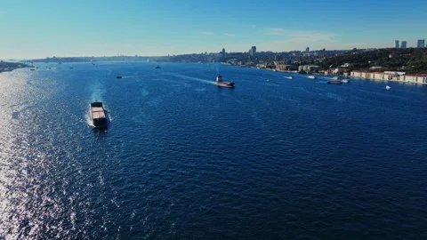 Aerial view of the Bosphorus Bridge with drone on a cloudy day. Tanker ship pass Stock Footage 322913579