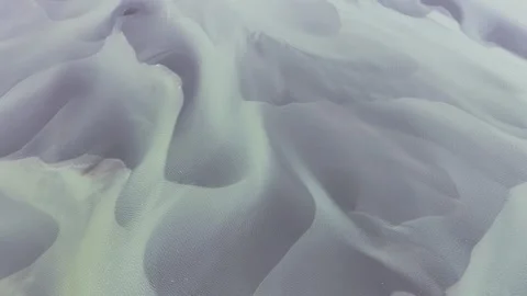 Aerial view of braided glacial river patterns, Iceland. Stock Footage 340282471