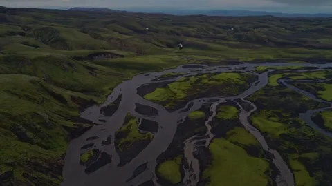 Aerial view of braided glacial river system with moss-covered tundra, Iceland Hi Stock Footage 341606133