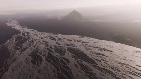 Aerial view of braided river and green mountain, Iceland. Stock Footage 337459949
